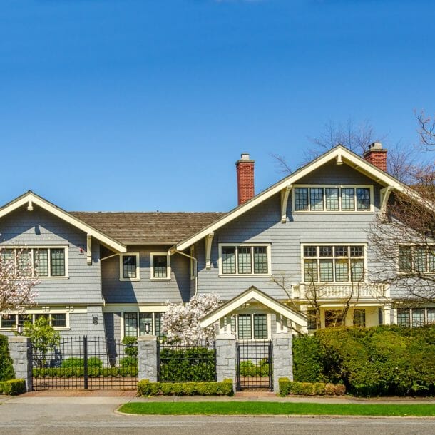 Large Blue House with Gated Entrance